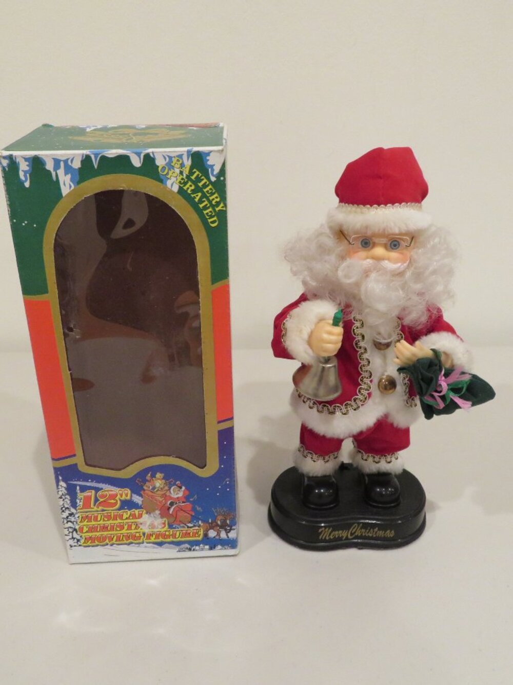 Vintage battery‑operated animated Santa Claus figure.